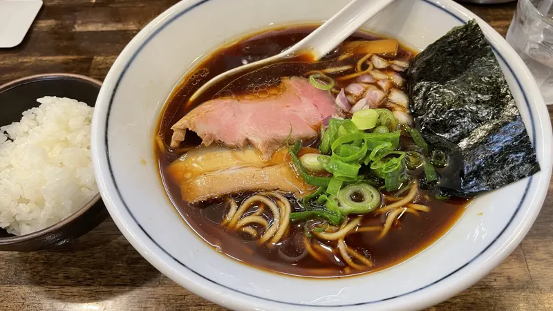 Enjoying Toyama Black Ramen near the falls