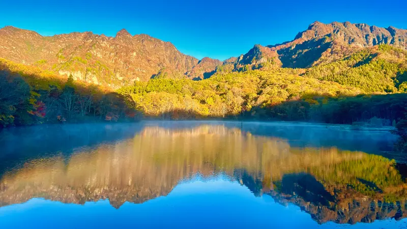 Serene Mirror Pond reflecting autumn colors