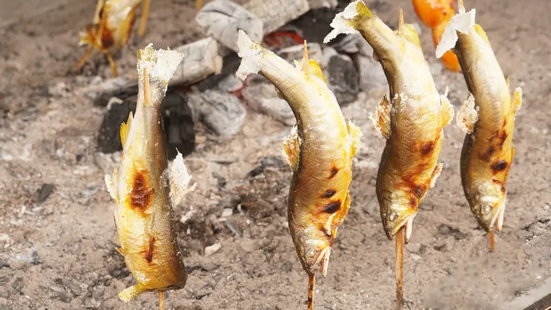 Grilled river fish served on skewers