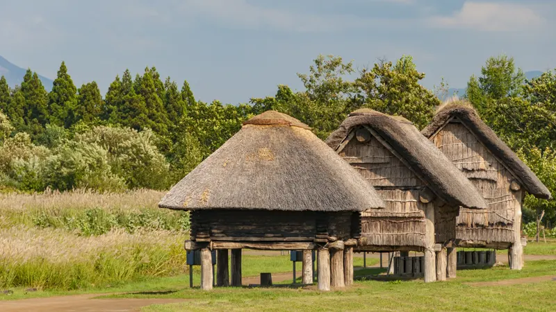 Three pit dwellings aligned